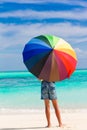 Child with parasol on beach Royalty Free Stock Photo