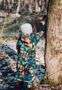 a child in the park feeds a squirrel with a carrot Royalty Free Stock Photo