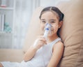 Child patient inhalation therapy by the mask of inhaler with soft stream smoke from bronchodilator. Royalty Free Stock Photo