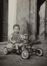 Child in the pedal car in the 50s Royalty Free Stock Photo