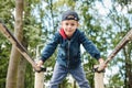 The child performs exercises on parallel bars on the street. Active lifestyle Royalty Free Stock Photo