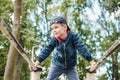 The child performs exercises on parallel bars on the street. Active lifestyle Royalty Free Stock Photo