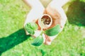 Child or person holding eggshell with germinated sprout - planting seedling vegetables or plants in used egg shell. Montessori