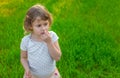 Child picking his nose. Selective focus. Royalty Free Stock Photo