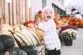 Child picking pumpkins at pumpkin patch