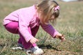 Child picking weeds