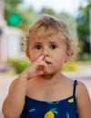 The child picks his nose. Selective focus. Royalty Free Stock Photo