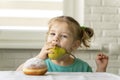 The child picks the pear, not the donut. proper nutrition concept