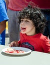 Child in pie eating contest Royalty Free Stock Photo