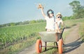 Two brothers play together in the field.Child pilot aviator with airplane dreams of traveling. Royalty Free Stock Photo