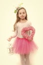 Child with pink heart wreath and xmas lantern