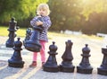 Child play chess figures outdoor