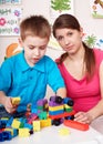 Child play construction set in games room. Royalty Free Stock Photo