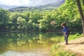 Child play fishing near lake. Royalty Free Stock Photo