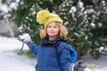 Child play with snow in winter park. Kids with first snow. Child winter holiday. Smiling boy playing with snow in winter Royalty Free Stock Photo