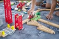 Child play with wooden train, build toy railroad at home or kindergarten. Toddler kid play with wooden train Royalty Free Stock Photo