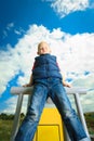 Child in playground kid in action boy play on leisure equipment Royalty Free Stock Photo