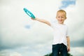 Child in playground kid in action boy playing with frisbee Royalty Free Stock Photo