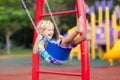 Child on playground. swing Kids play outdoor Royalty Free Stock Photo