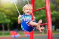 Child on playground. swing Kids play outdoor Royalty Free Stock Photo