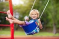 Child on playground. swing Kids play outdoor Royalty Free Stock Photo