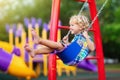 Child on playground. swing Kids play outdoor Royalty Free Stock Photo