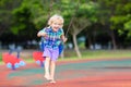 Child on playground. swing Kids play outdoor Royalty Free Stock Photo