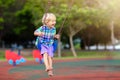 Child on playground. swing Kids play outdoor Royalty Free Stock Photo