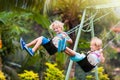 Child on playground. swing Kids play outdoor