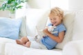 Child playing with baby cat. Kid and kitten Royalty Free Stock Photo