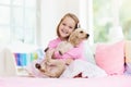 Child playing with dog. Kids play with puppy Royalty Free Stock Photo