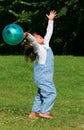 A Child Playing With a Ball