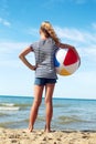 A child playing with a ball on the beach. Royalty Free Stock Photo