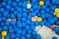 Child playing in ball pit. Colorful toys for kids. Kindergarten or preschool play room. Toddler kid at day care indoor Royalty Free Stock Photo