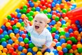 Child playing in ball pit on indoor playground Royalty Free Stock Photo