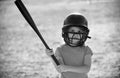 Child playing Baseball. Batter in youth league getting a hit. Boy kid hitting a baseball. Royalty Free Stock Photo