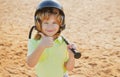 Child playing Baseball. Batter in youth league getting a hit. Boy kid hitting a baseball. Thumbs up. Royalty Free Stock Photo
