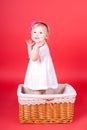 Child playing in a basket