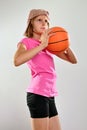 Child playing basketball and throwing ball Royalty Free Stock Photo