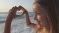 Child Playing on Beach, Kid Watching Sea Waves, Girl Makes Heart Shape Love Sign Royalty Free Stock Photo