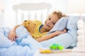 Child playing in bed. Kids room. Baby boy at home Royalty Free Stock Photo