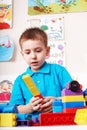 Child playing block and construction set. Royalty Free Stock Photo