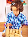 Child playing bricks.