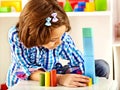 Child playing bricks.