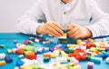 Child playing and building with colorful toy bricks, plastic blocks