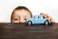 Child playing with the car close on a white background Royalty Free Stock Photo