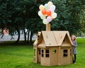 Child playing in a cardboard playhouse. Eco concept Royalty Free Stock Photo