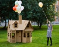 Child playing in a cardboard playhouse. Eco concept Royalty Free Stock Photo