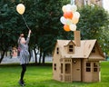 Child playing in a cardboard playhouse. Eco concept Royalty Free Stock Photo