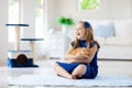 Child playing with cat at home. Kids and pets Royalty Free Stock Photo